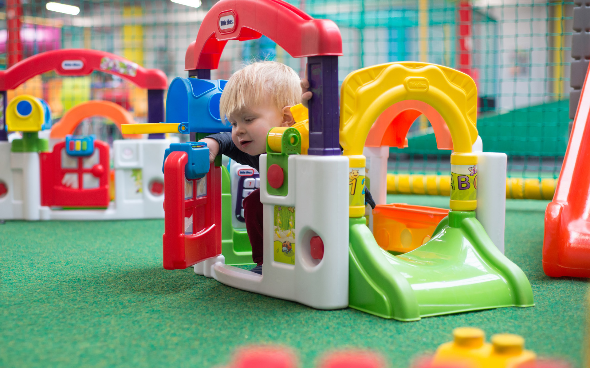 Toddler with play equipment